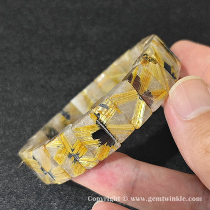 side profile view of machine polished golden rutilated quartz bangle bracelet