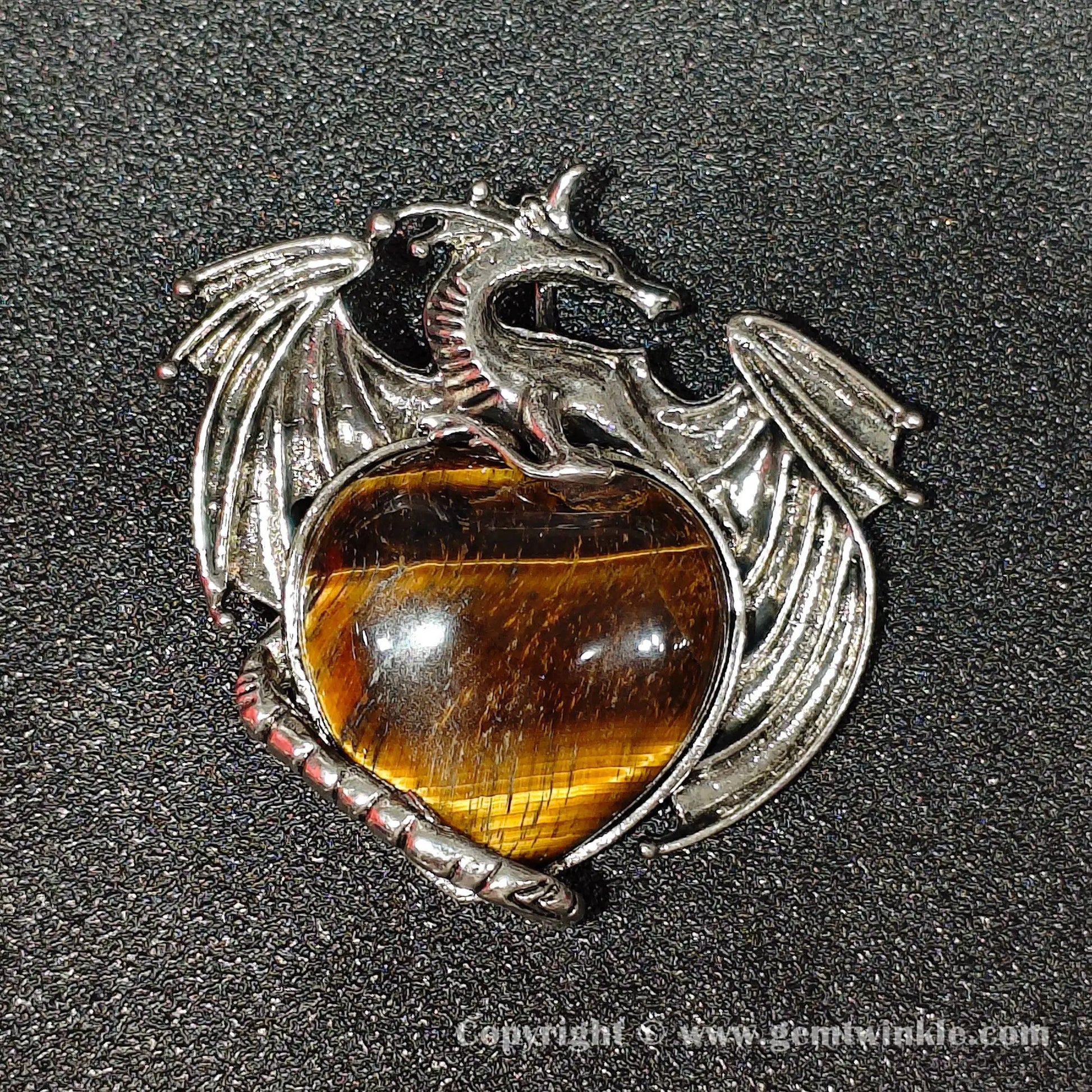 Angled view of 5cm gothic alloy dragon wrapped heart yellow tiger eye pendant