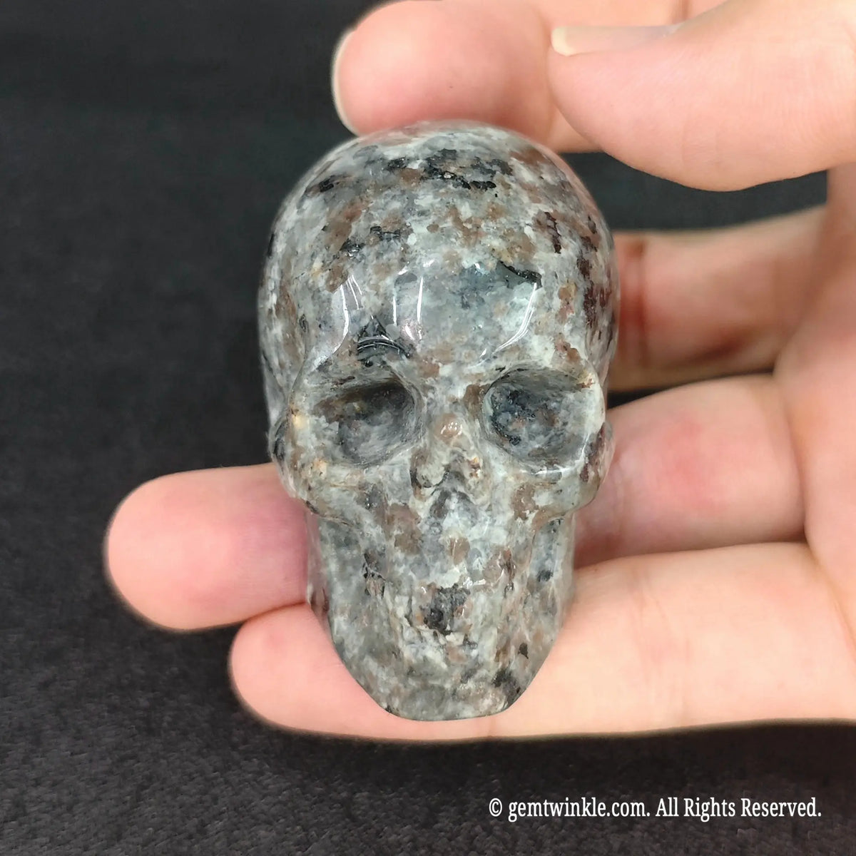 Full view of a gothic yooperlite mineral skull desk decor sculpture showing compact 5cm skull carving