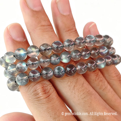 Close up preview of Grade A grey moonstone round beads highlighting smooth surface polish
