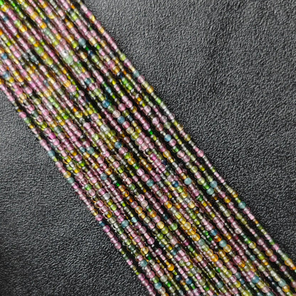 Grade B multi color tourmaline 2.5mm tiny gemstone beads macro close up view