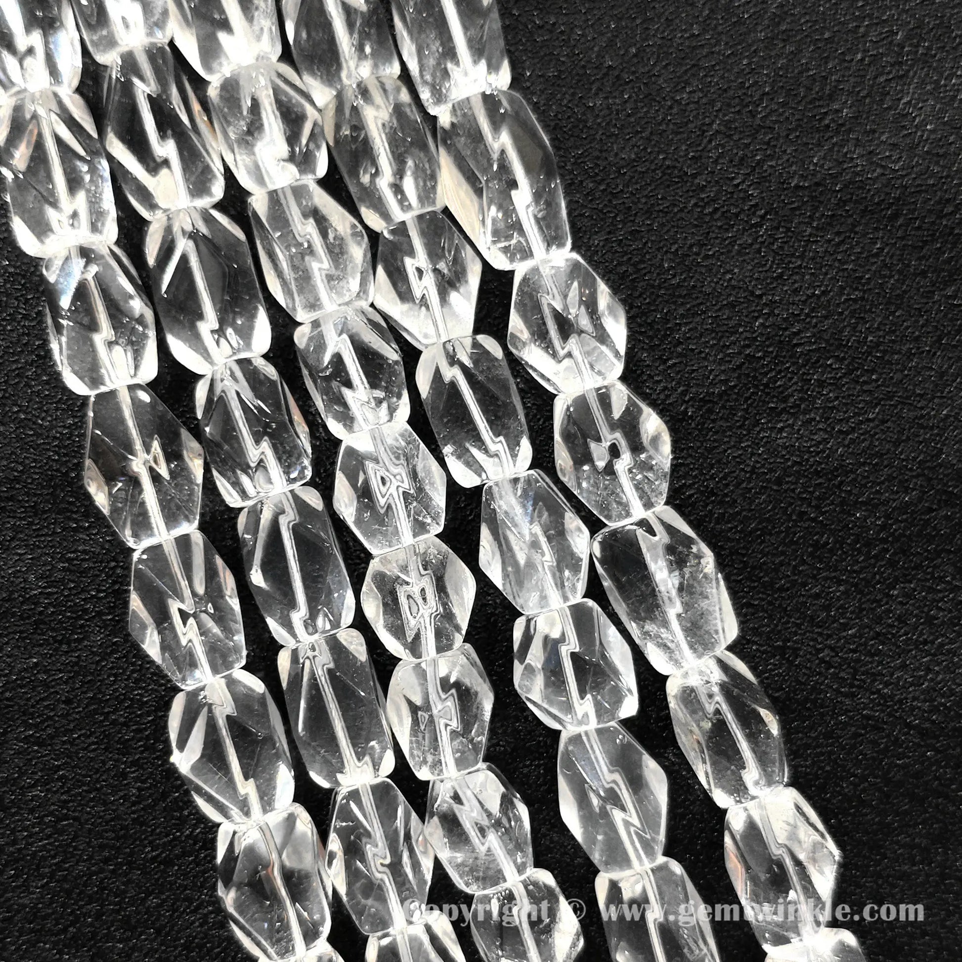 Multiple strands of 15mm natural clear quartz faceted freeform column beads