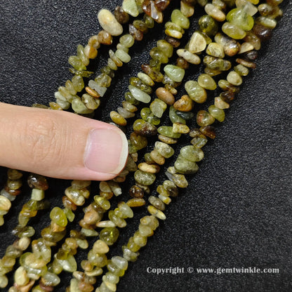 Close up view of natural green garnet chip beads demonstrating 80cm long strand yield