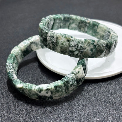 A natural green moss agate bamboo bracelet displayed in a lifestyle setting, perfect for boho or spiritual jewelry lovers.