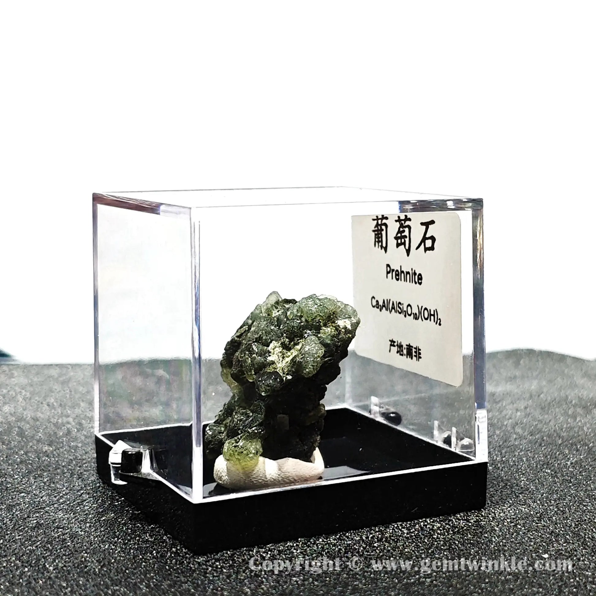Angled left perspective showing clear acrylic housing and raw green prehnite crystal cluster