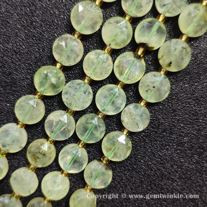 Close up view of translucent green prehnite star faceted flat beads showing facets