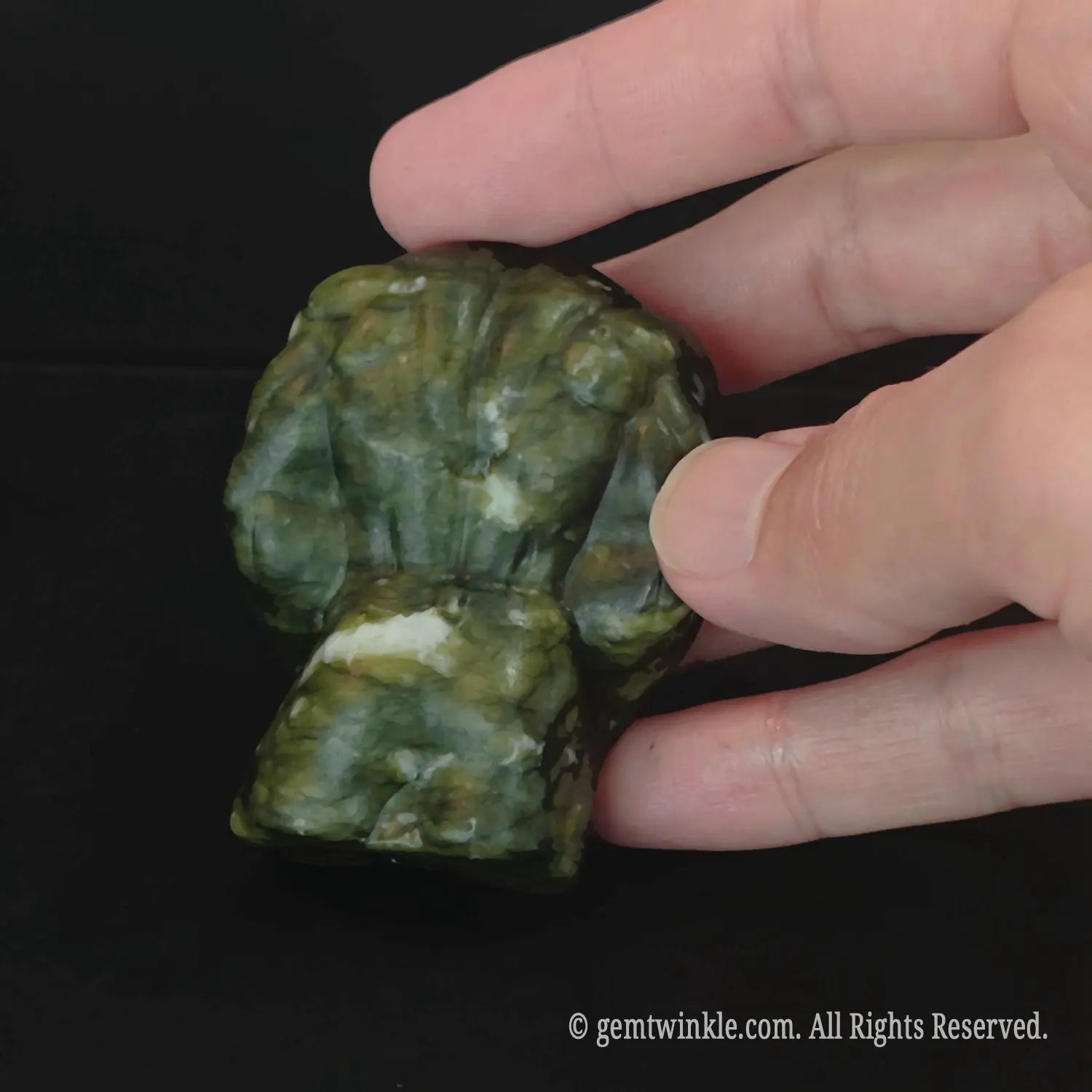 Back craftsmanship details of green serpentine natural stone muscular man body figurine