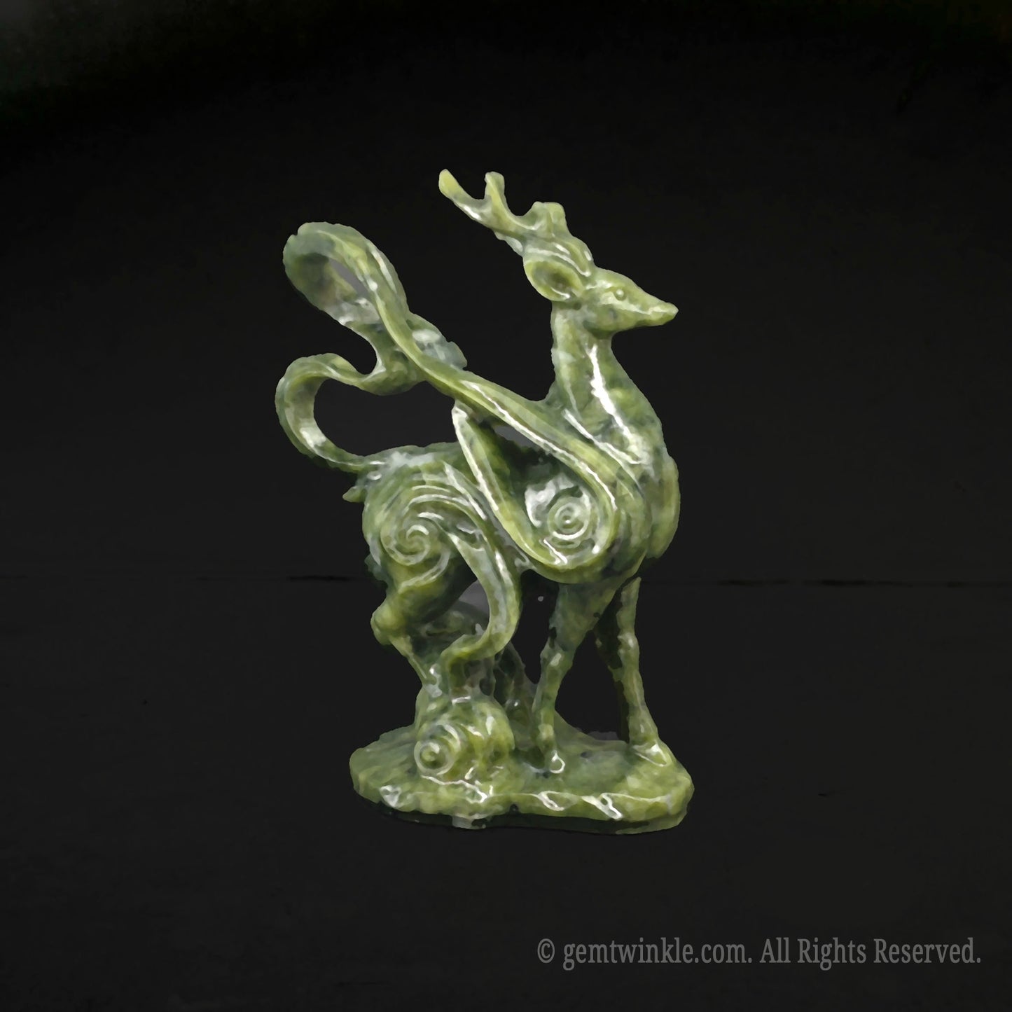 Side view of a 10cm green serpentine stone mystical deer figurine showcasing detailed cloud scroll carvings on a black background