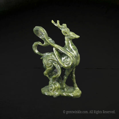 Side view of a 10cm green serpentine stone mystical deer figurine showcasing detailed cloud scroll carvings on a black background