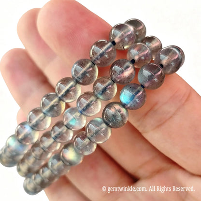 Preview of single-strand grey moonstone round bead bracelet showing natural labradorescence shimmer