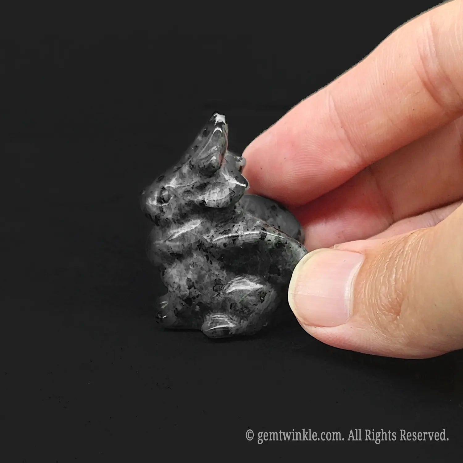 Grey speckled stone alicorn pocket pet sculpture showing detailed wings and horn structure