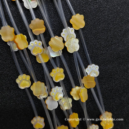 Handheld preview showing 10mm yellow mother of pearl cat paw beads
