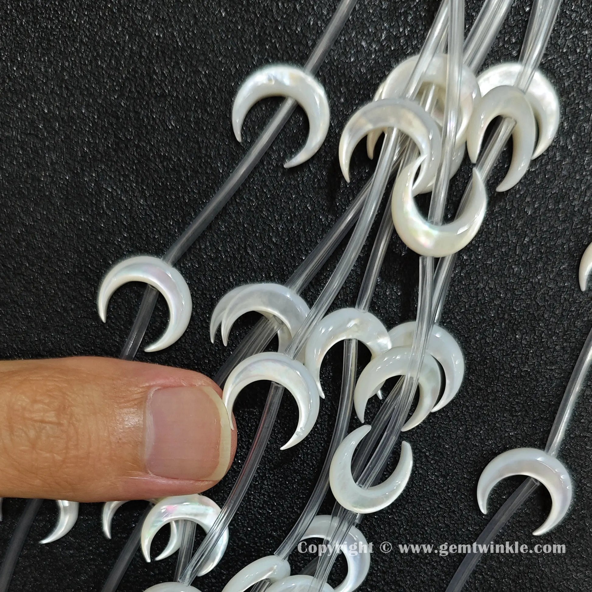 Handheld preview showing 14mm white mother of pearl moon beads