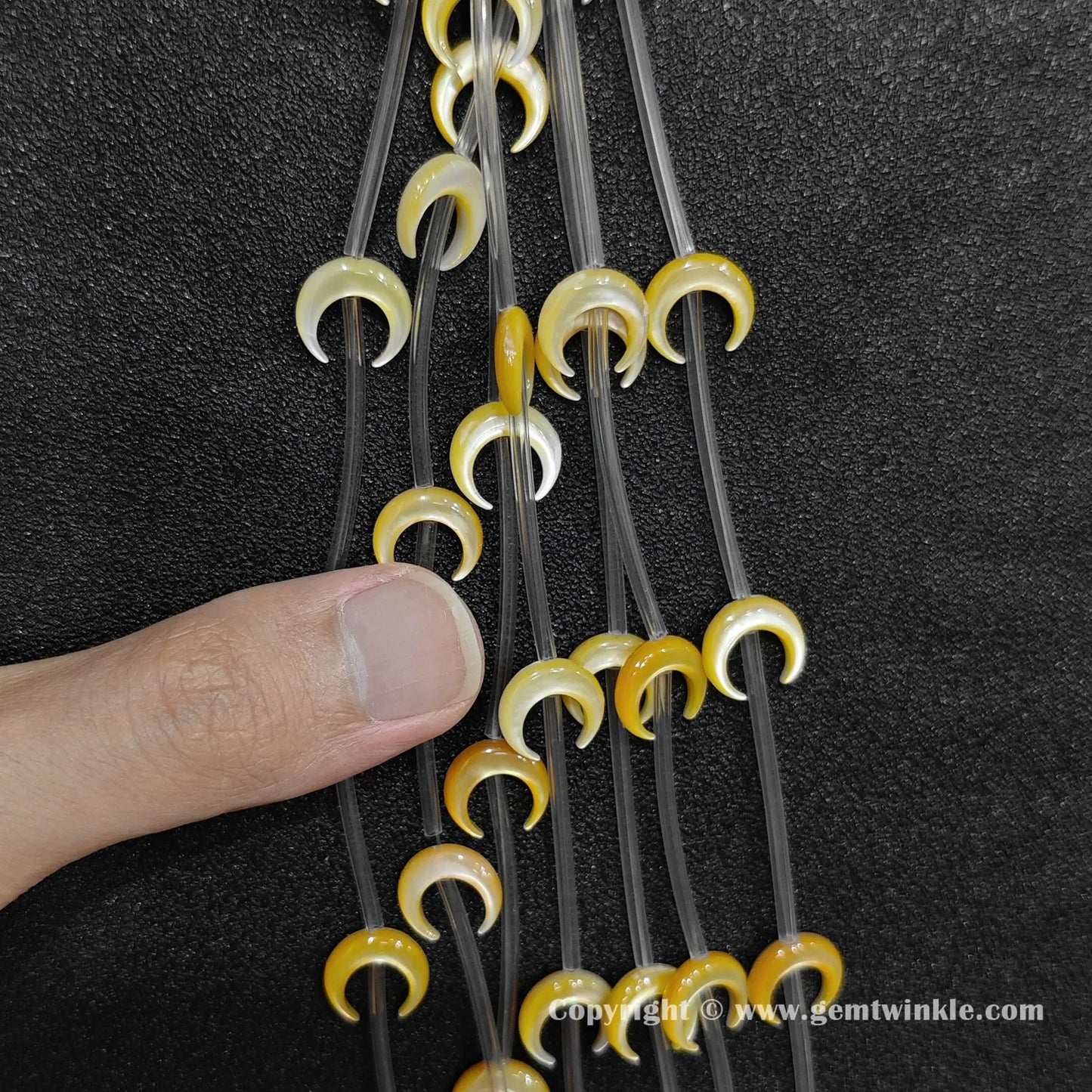 Handheld preview showing 14mm yellow mother of pearl moon beads