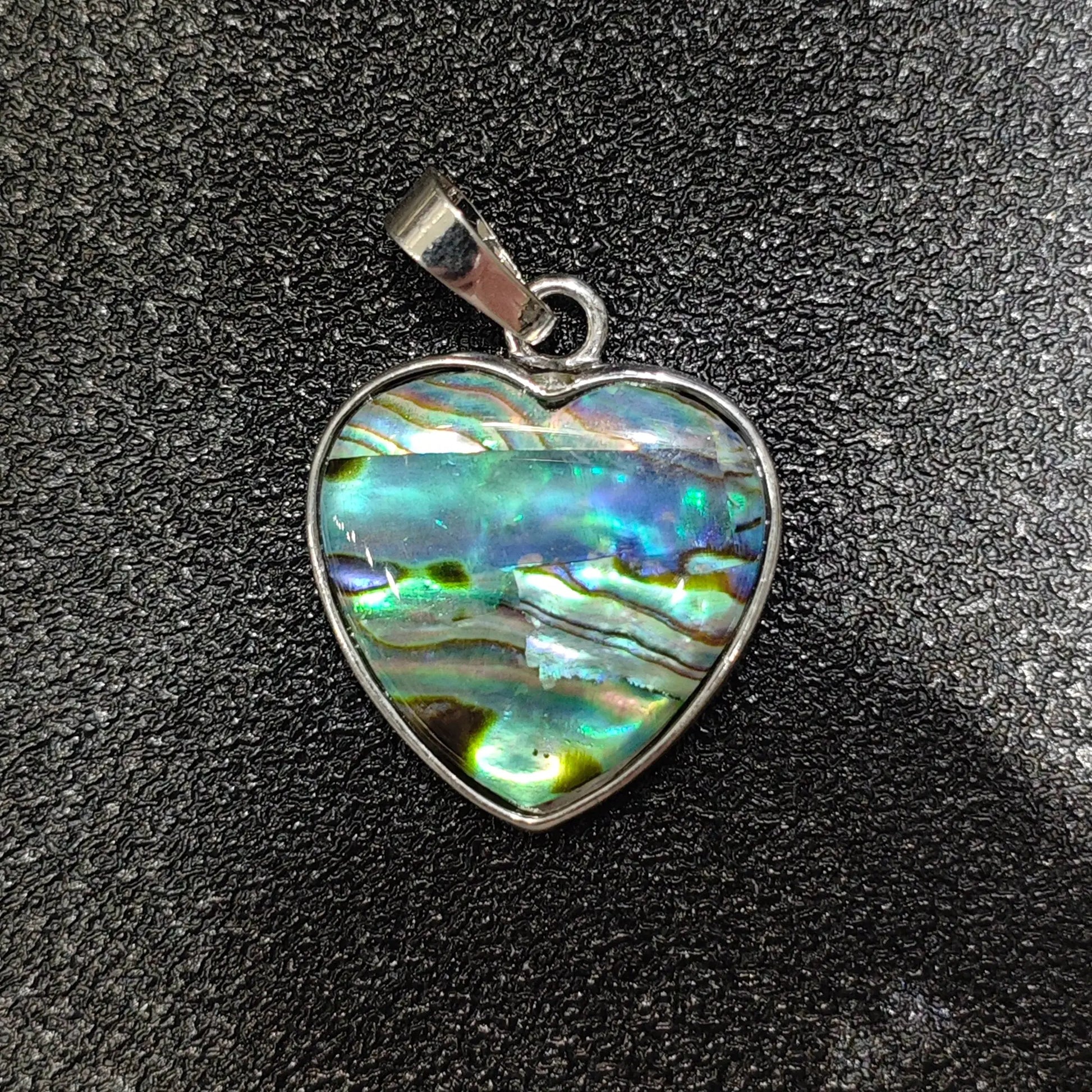 Heart-shaped composite abalone shell pendant 25mm with patchwork rainbow sheen in silver alloy frame