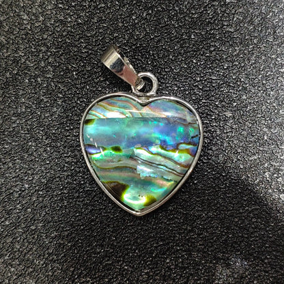 Heart-shaped composite abalone shell pendant 25mm with patchwork rainbow sheen in silver alloy frame