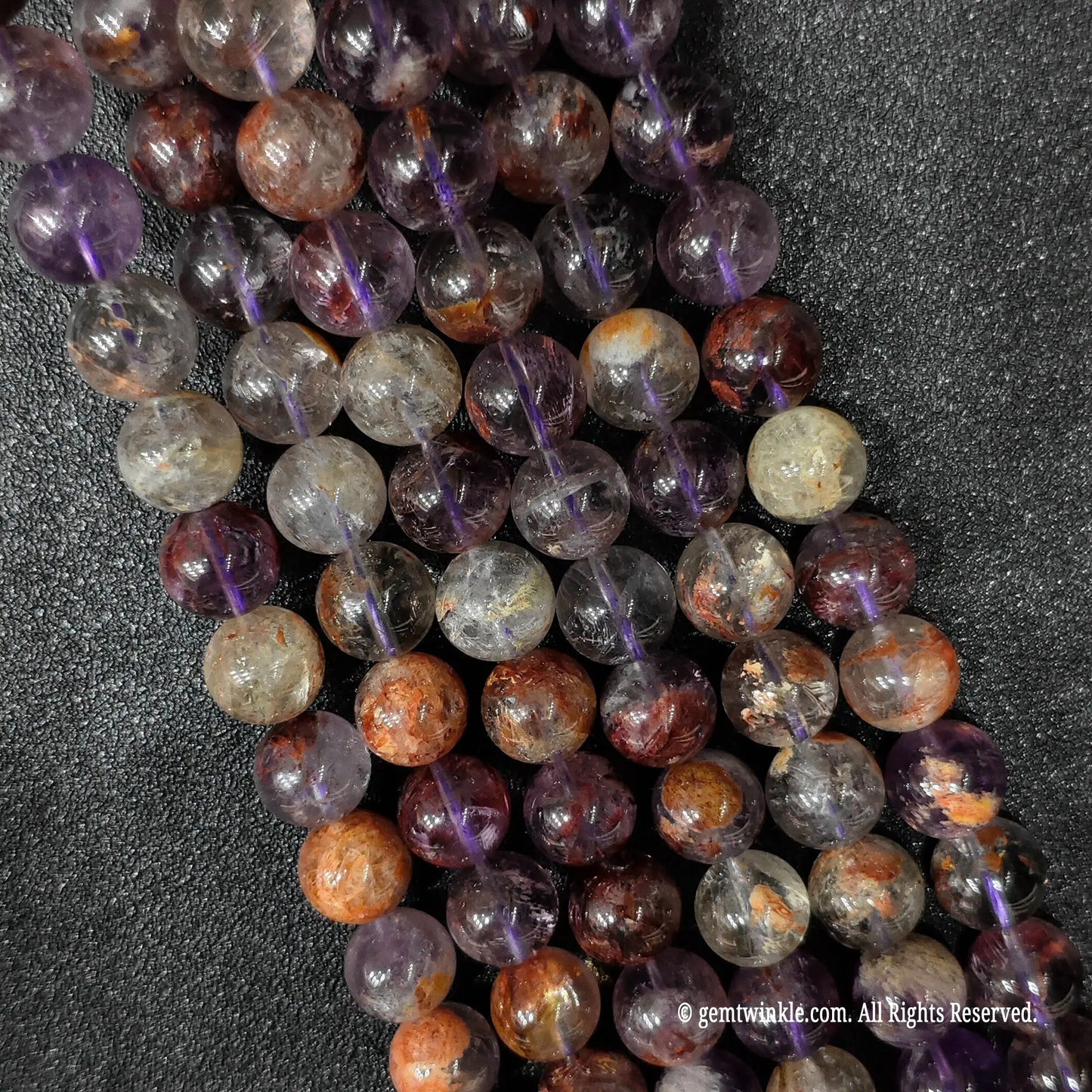 Heavy inclusion amethyst quartz round bead strands from our direct sourcing wholesale market inventory lots