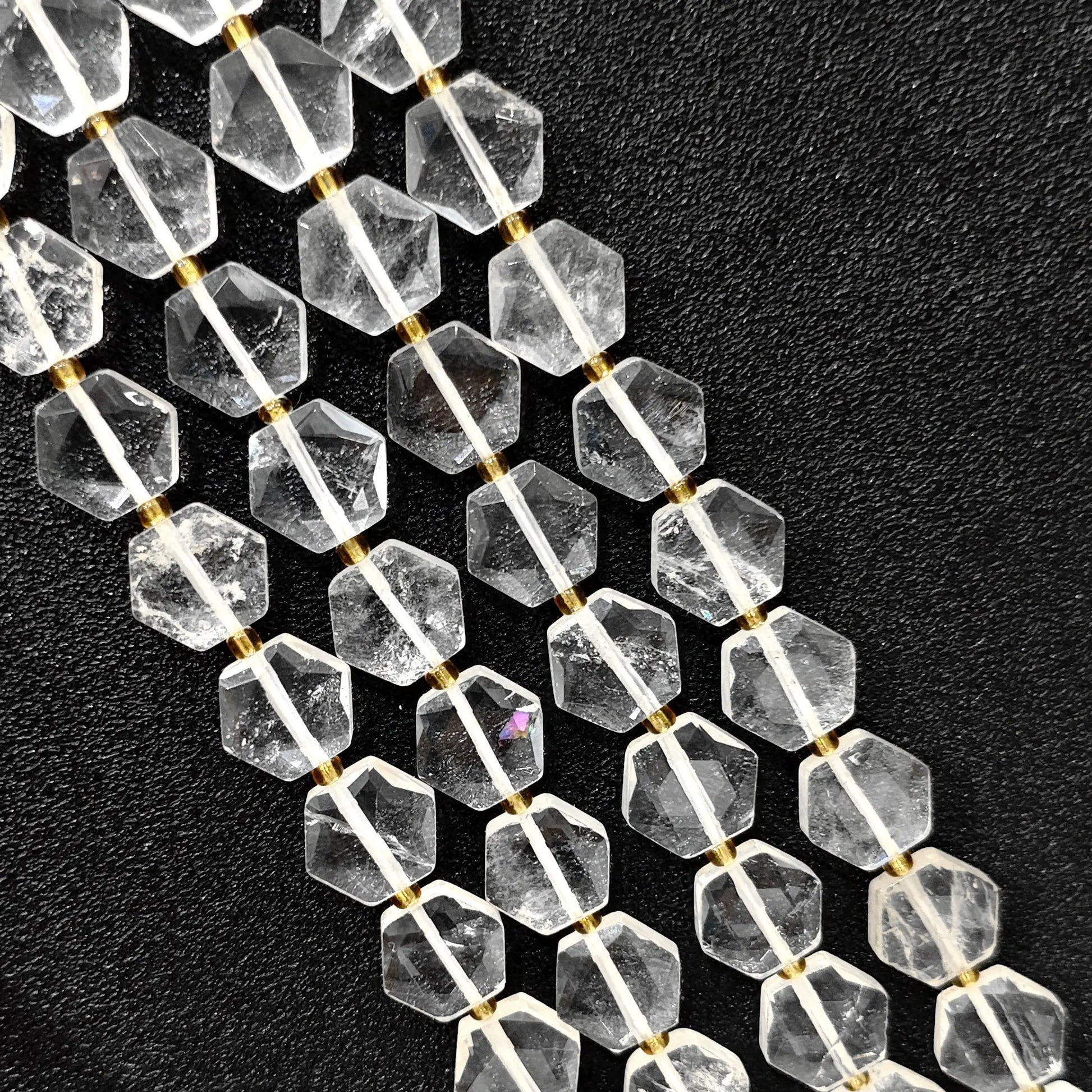 Strand of B-grade natural clear quartz hexagon flat coin beads 12mm