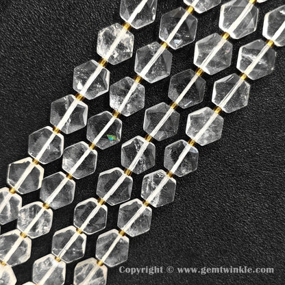 Close up view of hexagonal slice clear quartz beads on dark background