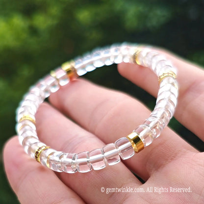 Angled view of a minimalist clear quartz crystal bracelet highlighting its sparkling transparency