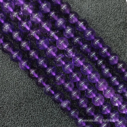 Macro detailed shot of high clarity natural deep purple amethyst gemstone strands showing minimal inner inclusions
