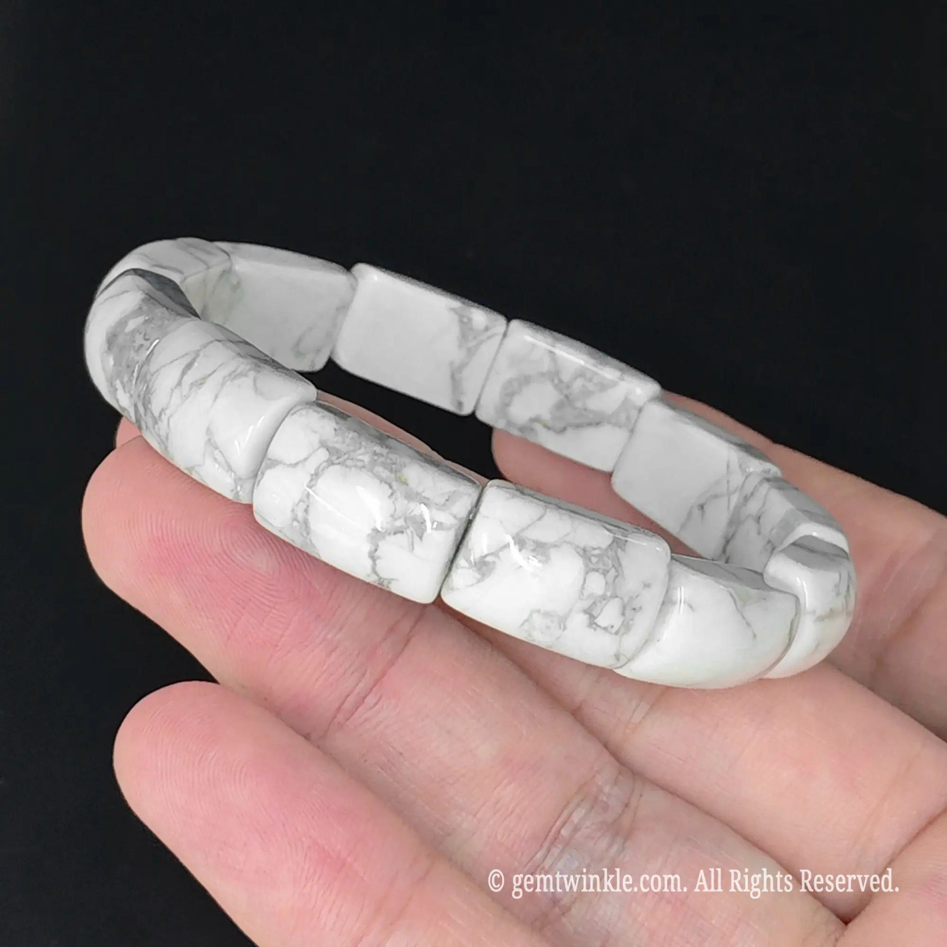 white howlite bar bead cuff bracelet resting on open palm displaying grey matrix