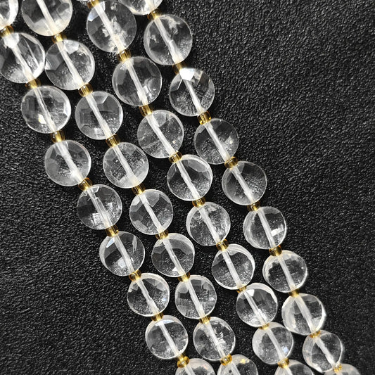 Strands of ice veined clear quartz faceted coin beads in flat disc shape