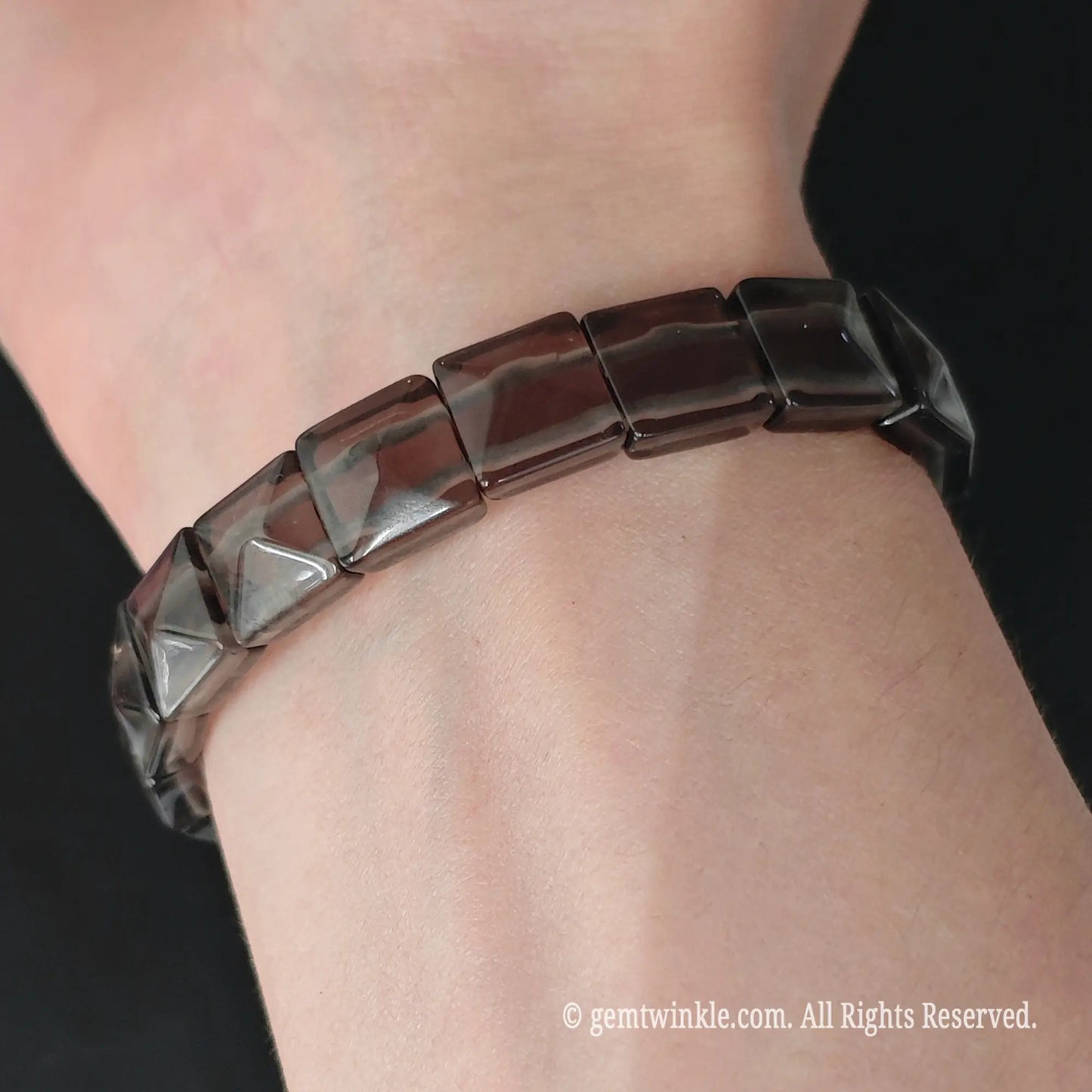 Ice obsidian 11mm square bead pyramid faceted stretch bracelet styled on wrist displaying geometric profile