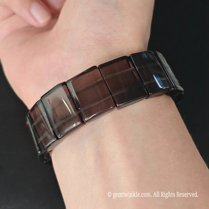 Ice obsidian 20x15mm curved rectangle plate stretch bracelet styled on wrist displaying geometric cuff profile