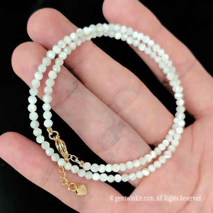 single strand white mother of pearl beads displaying organic shell luster