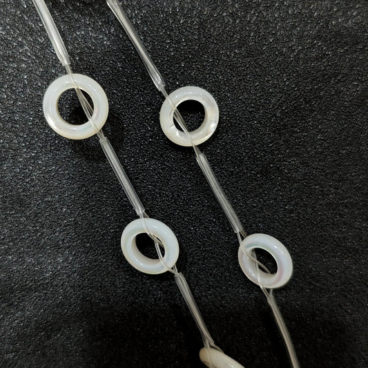 Laminated white mother of pearl donut ring beads full strand view