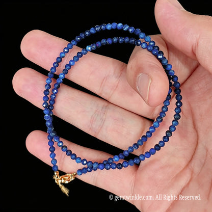 detail view of gold tone alloy clasp and 5cm extender chain on lapis lazuli necklace