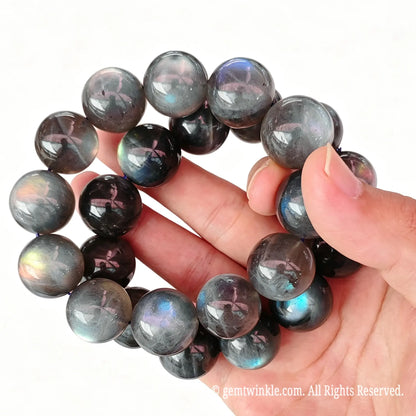 Close up preview of oversized 20mm grey moonstone round beads highlighting smooth polished finish