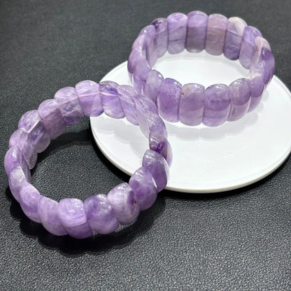 Closeup of Natural Lavender Amethyst Moon Bead Bracelet, highlighting the unique banding and translucence of the stone