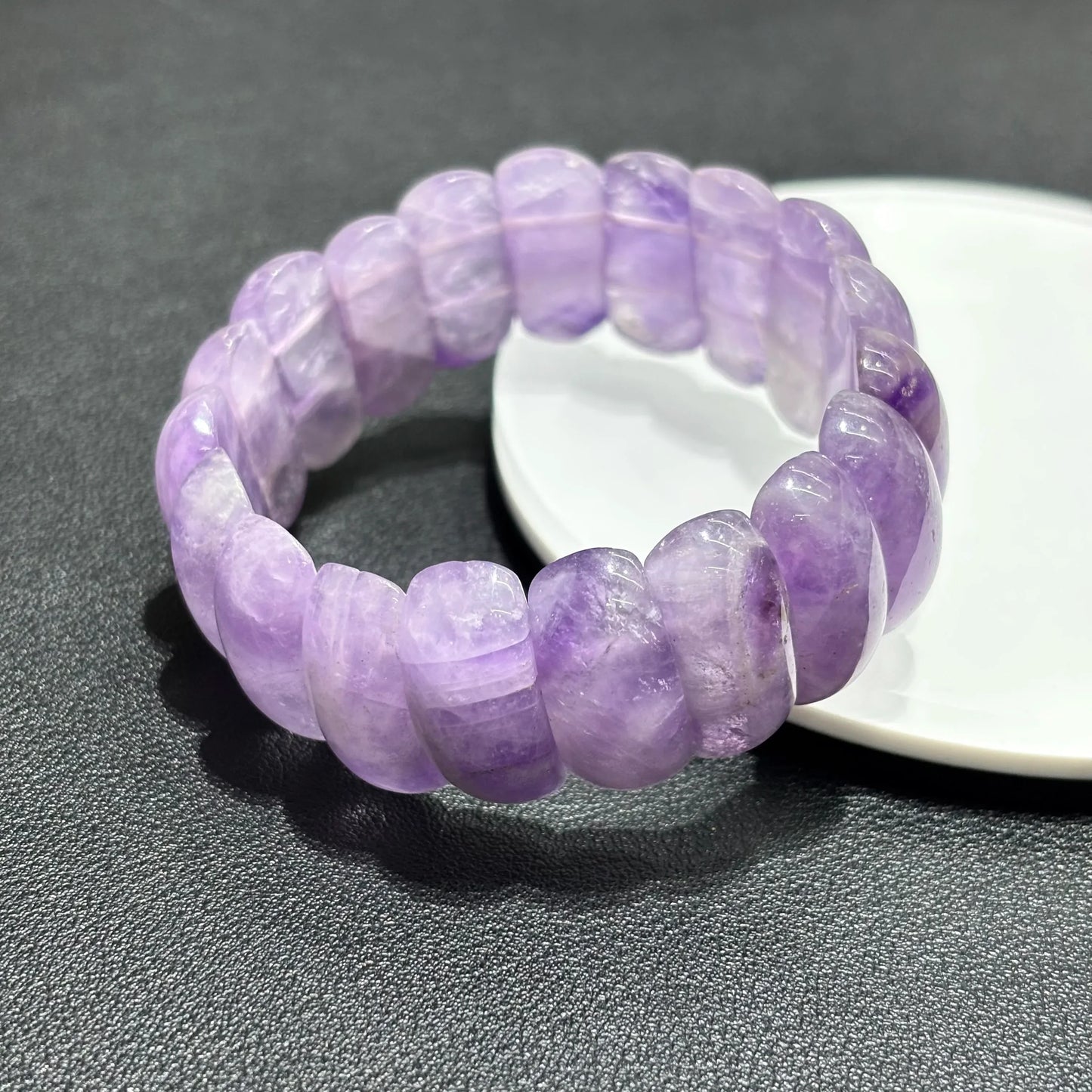 Side view of Natural Lavender Amethyst Moon Bead Bracelet, showing the 23x10mm moon-shaped beads and elastic stretch design