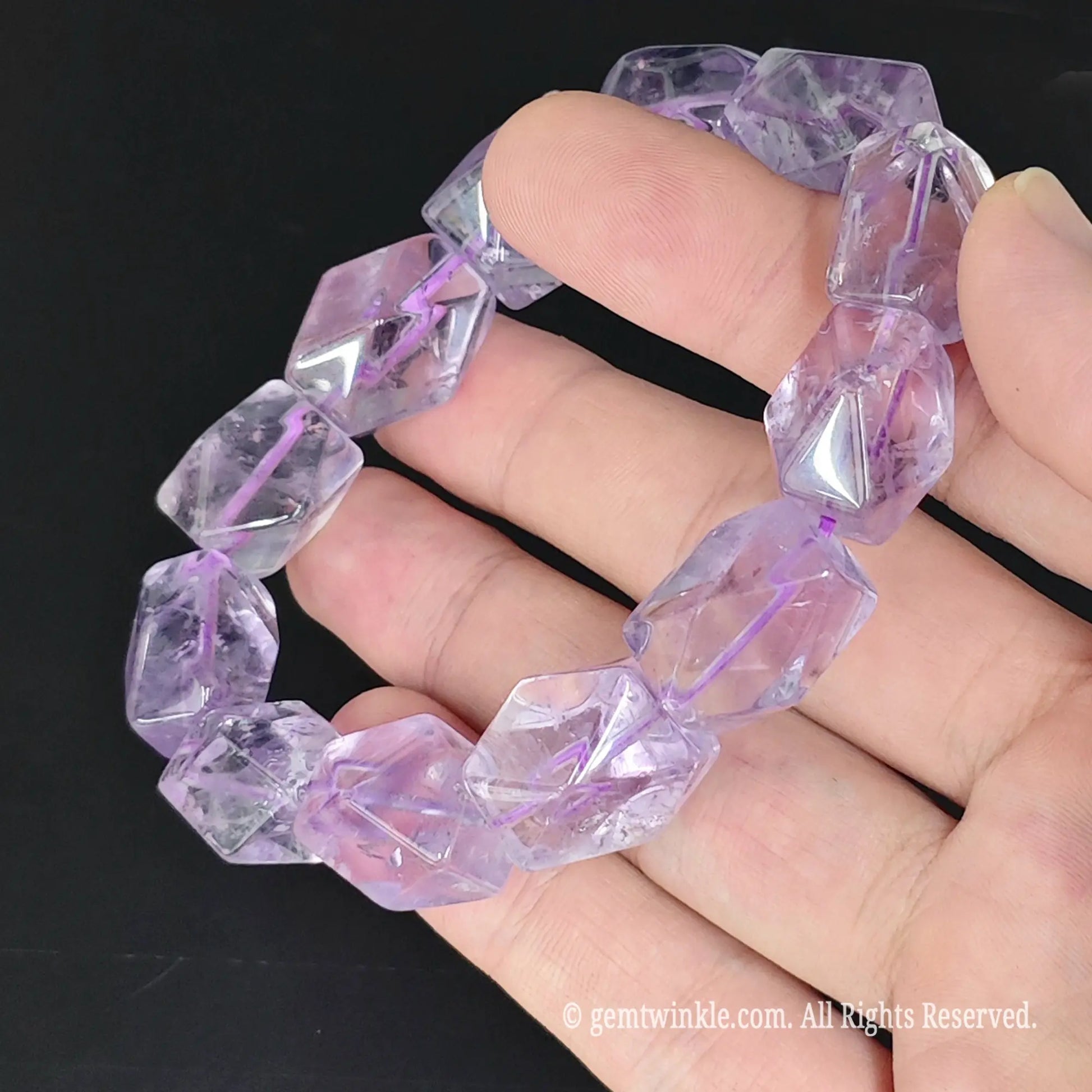 lavender quartz geometric nugget beads stretch strand on fingers