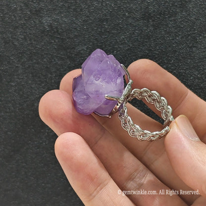 Lavender amethyst crystal specimen ring side view held in hand displaying filigree alloy band and natural stone height