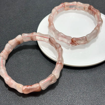 Layered bamboo quartz bracelets paired with other crystal jewelry.