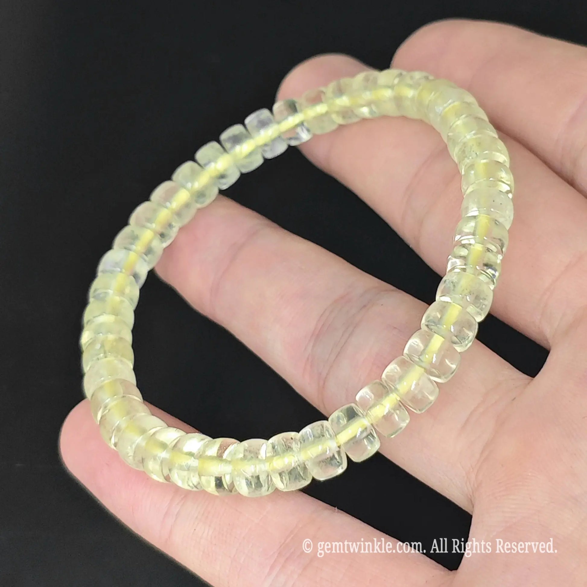 close up of clear yellow lemon quartz abacus disc bead stretch bracelet video