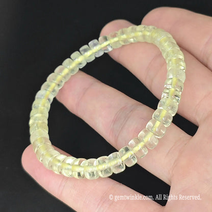 close up of clear yellow lemon quartz abacus disc bead stretch bracelet video