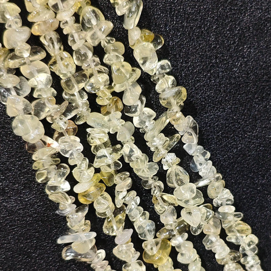 Luminous lemon quartz freeform chip beads in 5 to 10mm size on 75cm long strand