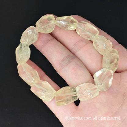 yellow lemon quartz geometric nugget beads stretch strand on palm