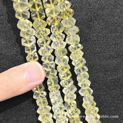Vertical alignment of sunny lemon quartz prismatic cylinder column beads on dark surface