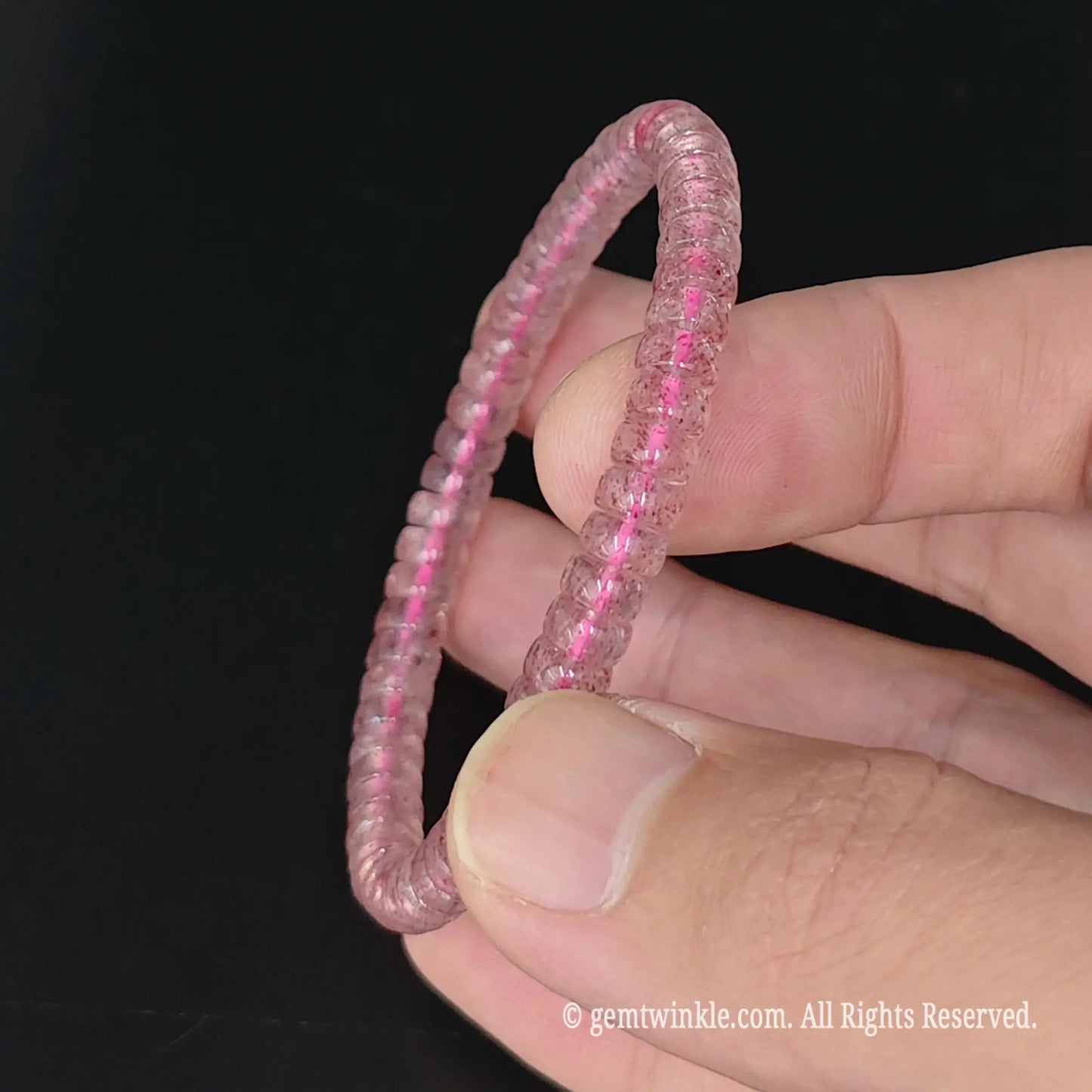 top view of 5.5-6mm strawberry quartz saucer wheel bead stretch bracelet 16cm