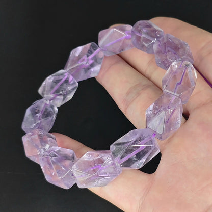 hand holding light amethyst faceted freeform beads stretch bracelet