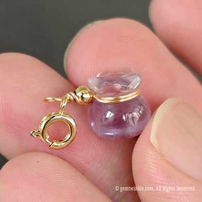 Light amethyst 11mm money bag pendant showing attached gold clasp ring for easy jewelry attachment