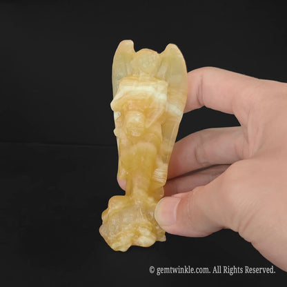 yellow calcite fallen lucifer statue