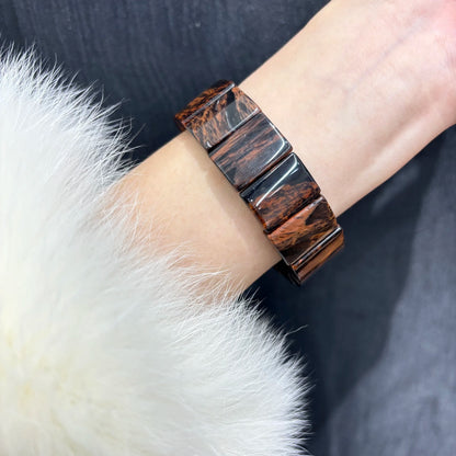 Mahogany Obsidian Bangle Bracelet Worn on Wrist, Close Up View, Fashion Accessory, Daily Wear, Elastic Stretch Fit