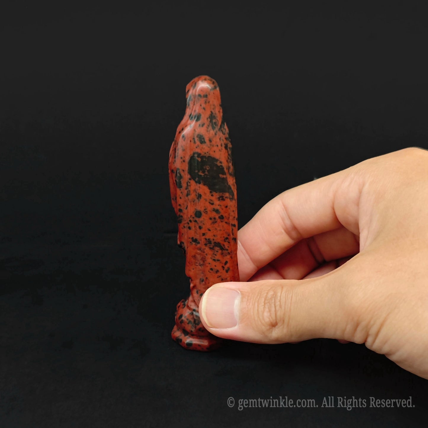 Back view of the hand carved mahogany obsidian Madonna figurine highlighting natural mineral waves