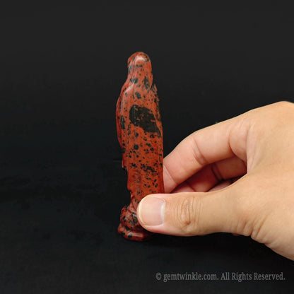 Back view of the hand carved mahogany obsidian Madonna figurine highlighting natural mineral waves